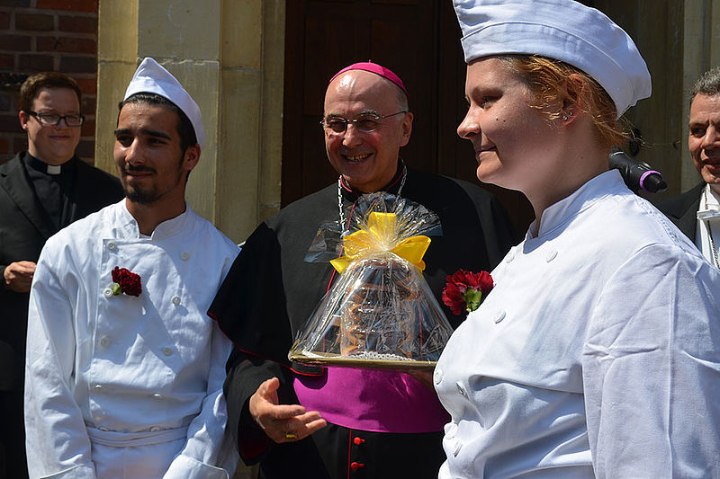 Der Bischof mit Vertretern der münsterschen Bäckergilde